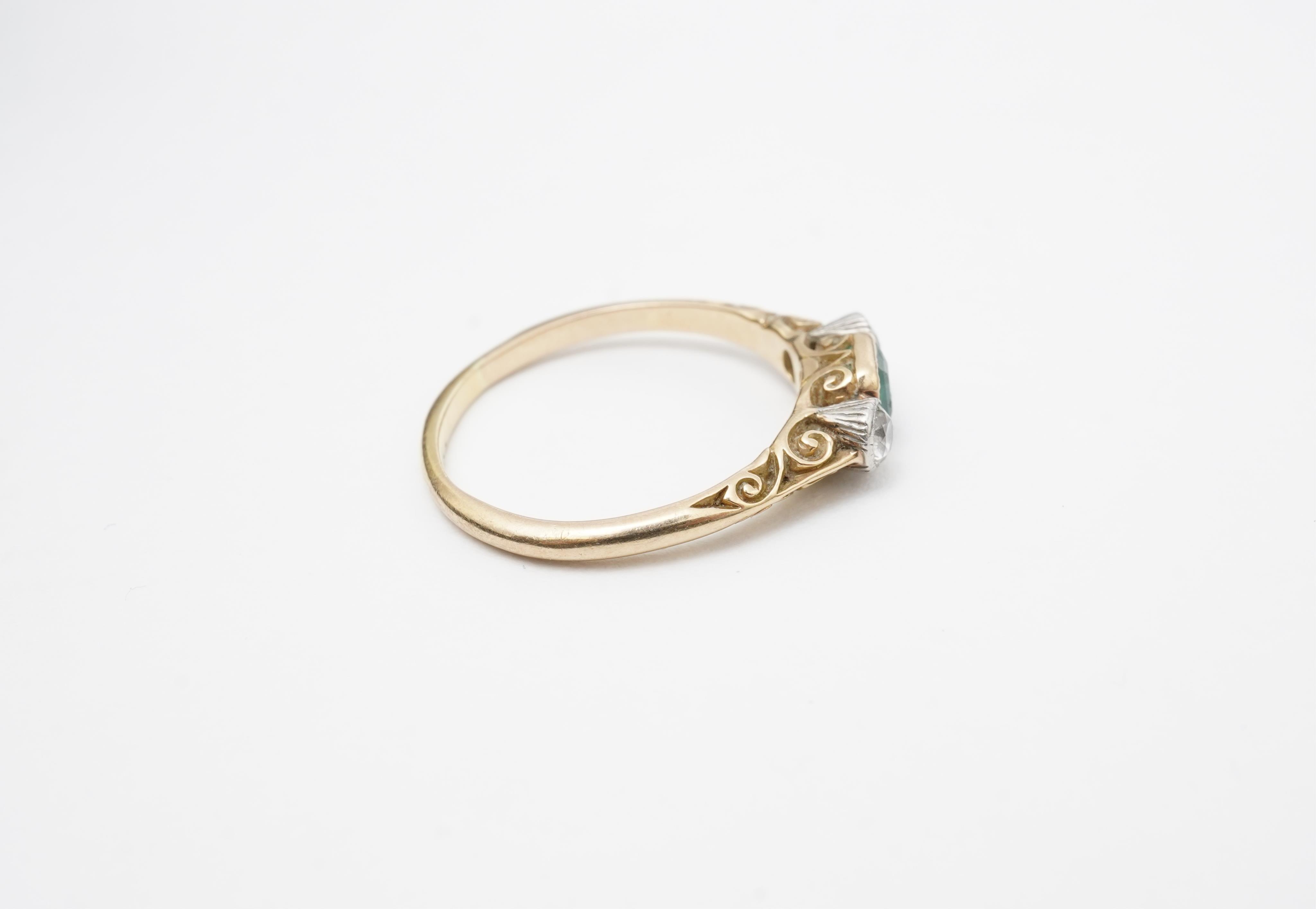 An emerald and diamond ring, early 20th century